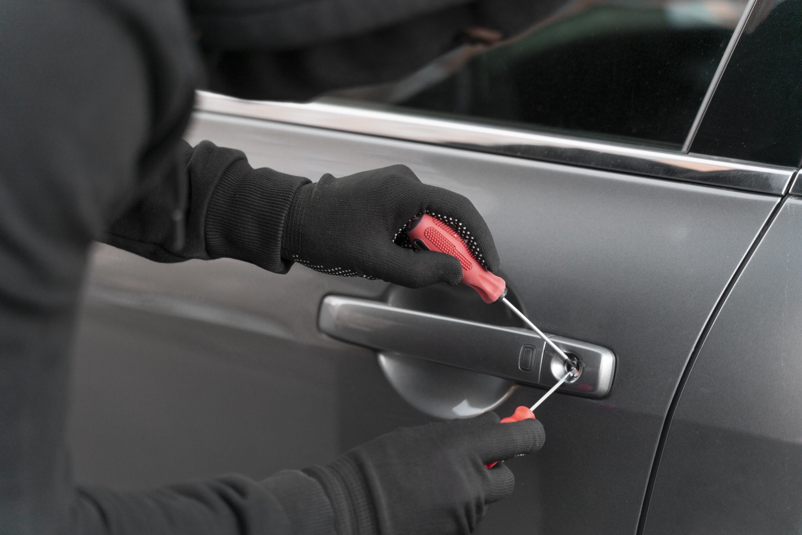 close-up-man-trying-break-into-car