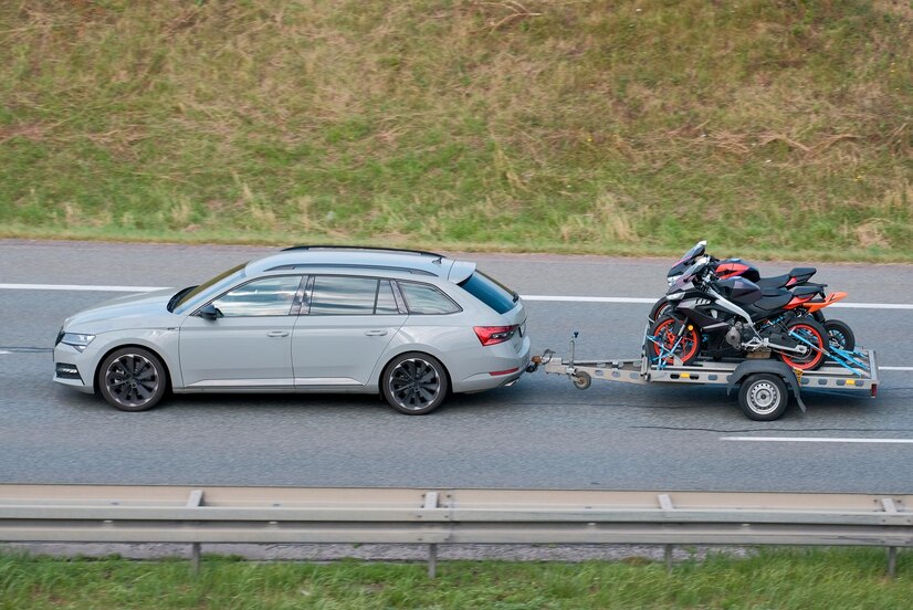 conventional-wagon-car-towing-trailer-with-motorcycles_909686-1302